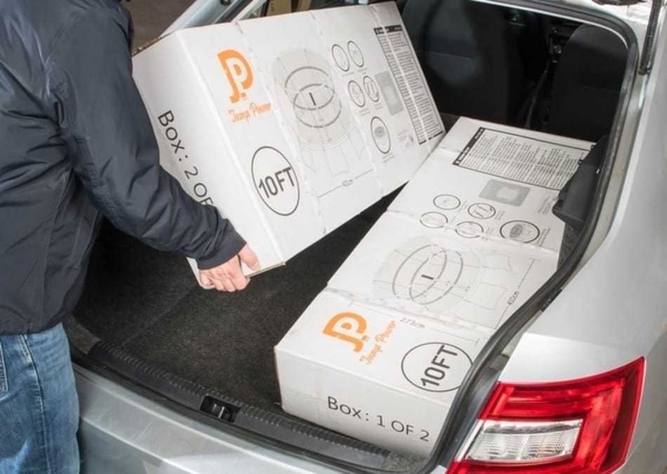 photo of trampoline boxes in trunk